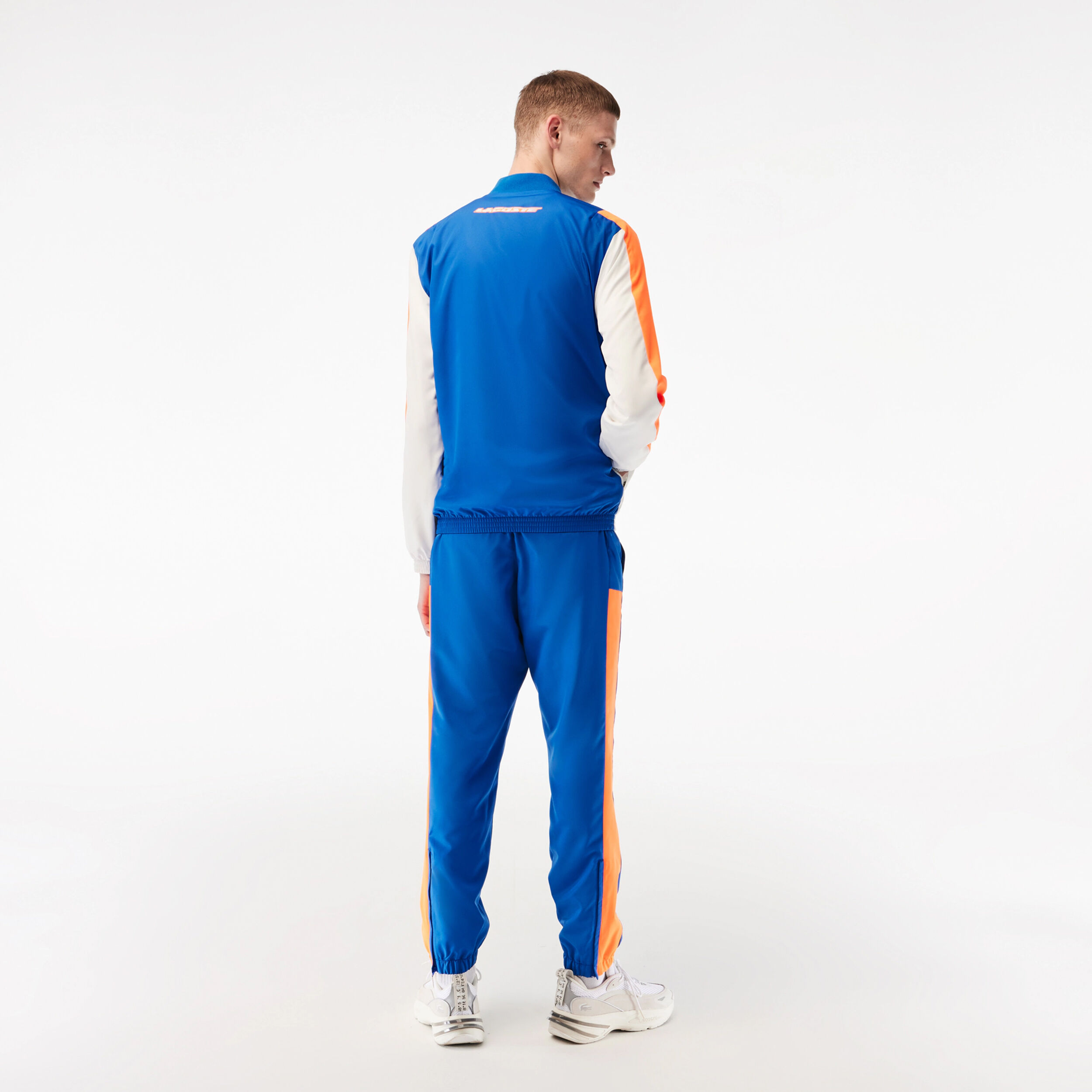 Lacoste trainingspak oranje sales